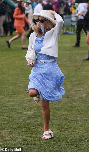 The crowd at Flemington Racecourse was soaked