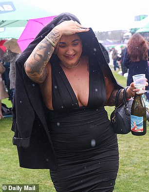 Attendees did their best to stay dry