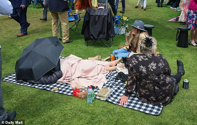 Strategic racegoers claimed their plot in the massive crowd