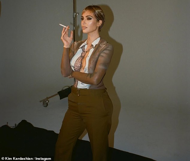 She went from pinstripe suits channeling a 1920s gangster vibe to a daring topless moment, letting her cleavage steal every frame