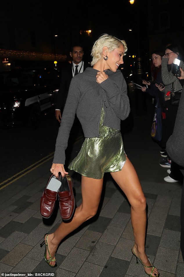 The model, 25, who is the daughter of Jude Law and Sadie Frost , showed off her figure in a dazzling green minidress