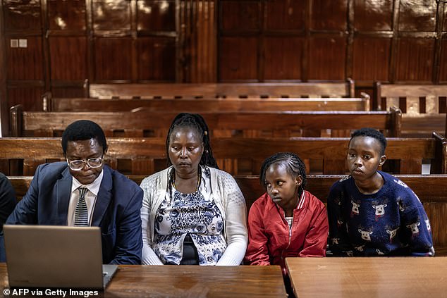 The Wanjiru family (pictured alongside their legal representative, left) in court. In September, a Nairobi High Court judge issued an arrest warrant for Purkiss, a married father of two, with local prosecutors saying extradition proceedings would be initiated to bring him before a Kenyan court