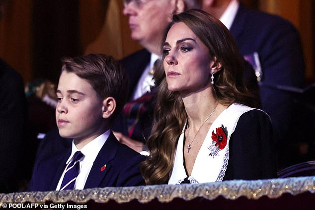 George watches as emotional videos of veterans speaking about their experiences played