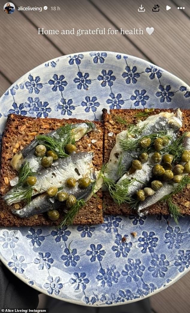 Sharing that she had since been discharged, Alice posted a photo of lunch of anchovies, dill and caper on toast with the caption: 'Home and grateful for health'