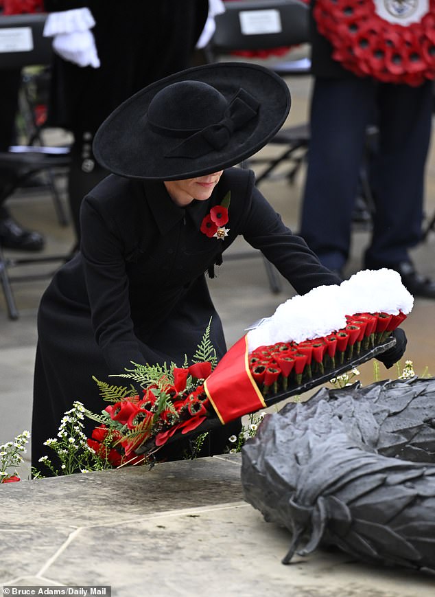Catherine lays a wreath at the Armed Forces Memorial today, which features a handwritten note