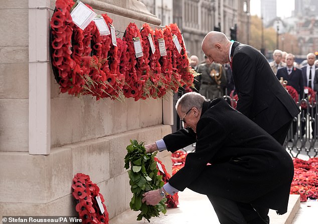 Defence Secretary John Healey (right) and Charles Garrett lay wreaths of poppies during the Western Front Association's Armistice Day ceremony
