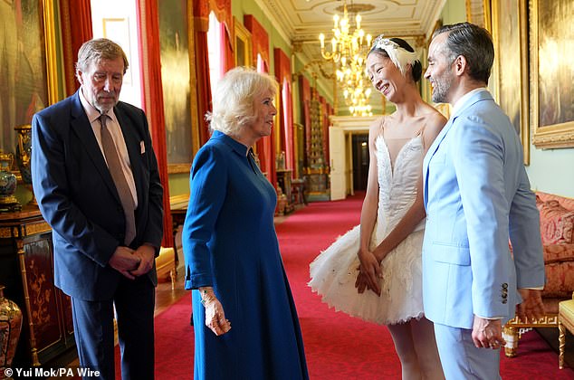 Following the performance, Camilla, wearing a blue Anna Valentine dress with a Van Cleef & Arpels ballerina brooch, told the ballerina it was 'wonderful'