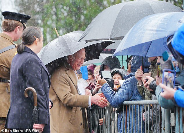 The King meets wellwishers as he leaves after a visit to Cyfarthfa Castle