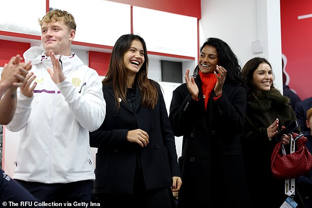 Fin Smith of England, British tennis player, Emma Raducanu and actor, Simone Ashley celebrate in the England dressing room following England's victory during the Quilter Nations Series 2025 rugby international match between England and New Zealand at Allianz Stadium on November 15, 2025 in London, England