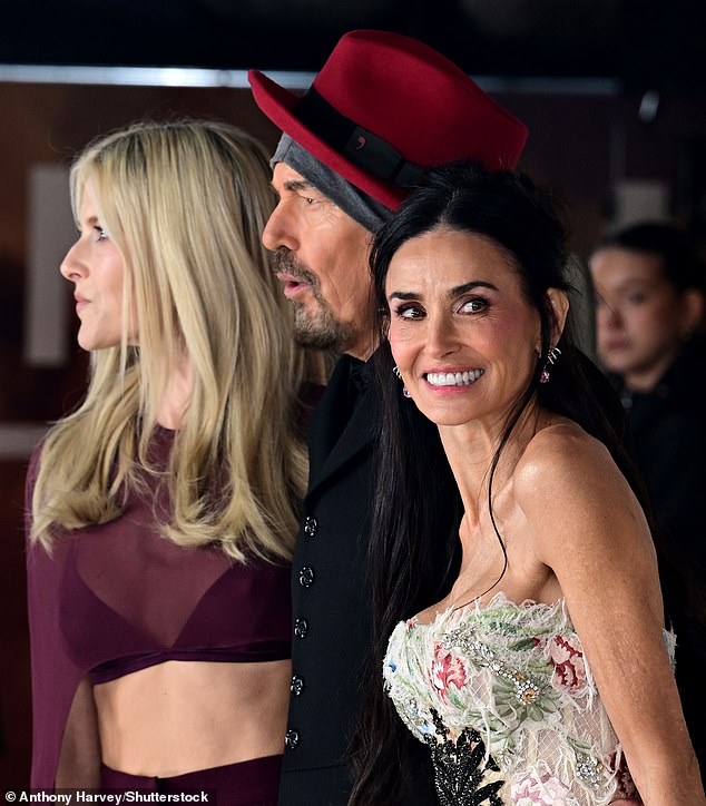 Her strapless gown featured multicoloured embroidered flowers over a corseted bodice and structured skirt