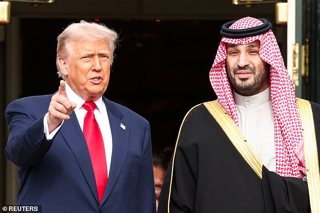 U.S. President Donald Trump greets Saudi Crown Prince and Prime Minister Mohammed bin Salman during an arrival ceremony on the South Lawn of the White House in Washington, D.C., U.S., November 18, 2025. REUTERS/Kevin Lamarque