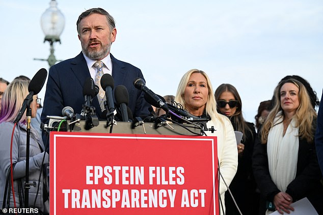 U.S. Representative Thomas Massie (R-KY), accompanied by U.S. Representative Marjorie Taylor Greene (R-GA), speaks during a press conference on the Epstein Files Transparency Act ahead of a House vote on the release of files related to the late convicted sex offender Jeffrey Epstein, on Capitol Hill in Washington, D.C., U.S., November 18, 2025. REUTERS/Annabelle Gordon