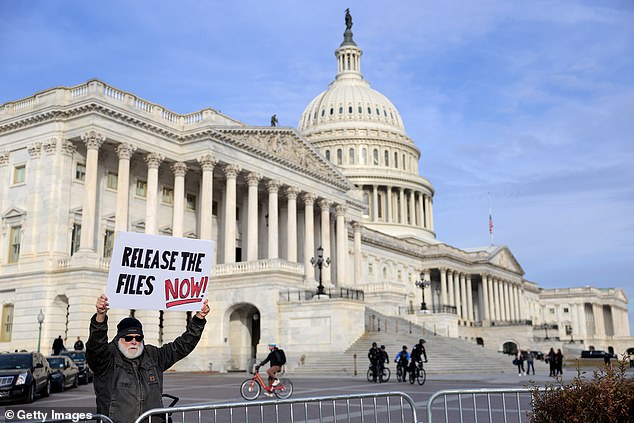 WASHINGTON, DC - NOVEMBER 18: A protester demonstrates outside the U.S. Capitol ahead of a press conference with lawmakers on the Epstein Files Transparency Act on November 18, 2025 in Washington, DC. The House is expected to vote today on the legislation, which instructs the U.S. Department of Justice to release all files related to the late accused sex trafficker Jeffrey Epstein. (Photo by Heather Diehl/Getty Images)