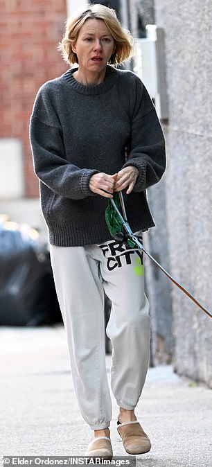 The following day Watts, 57, appeared careworn and makeup-free as she stepped out in New York City to take her tiny rescue dog Izzy for a walk