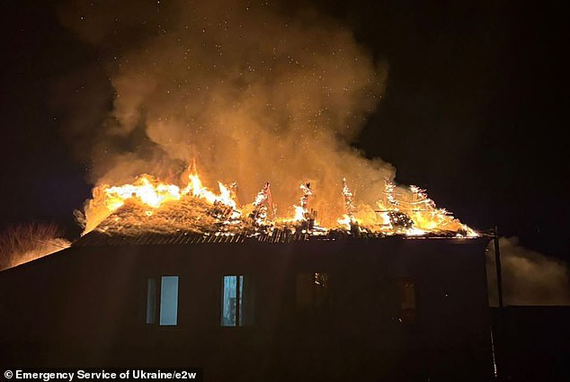 A residential building on fire after a Russian drone strike in Semenivka, Chernihiv region