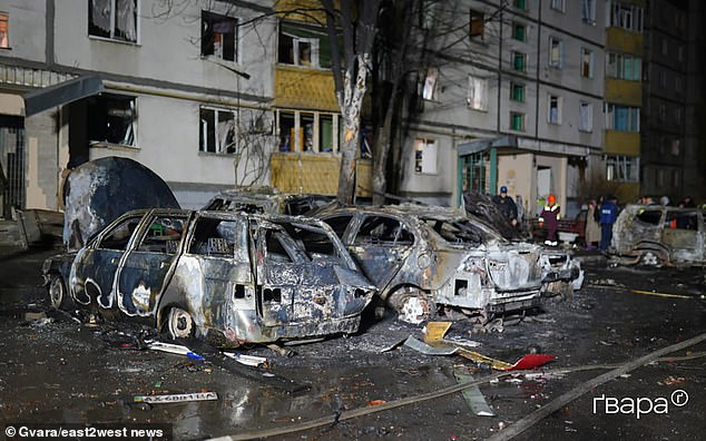Burnt cars on a residential street after Russian drones hit Kharkiv, damaging shops and critical infrastructure