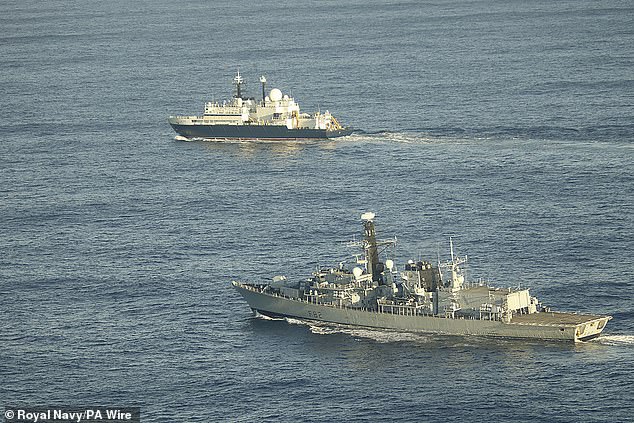 The Yantar (pictured, top of image, followed by the Royal Navy's HMS Somerset) is a Russian spy ship operated by the elusive GUGI unit