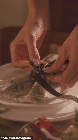 She had cloth napkins tied with green velvet ribbons placed atop porcelain dishes