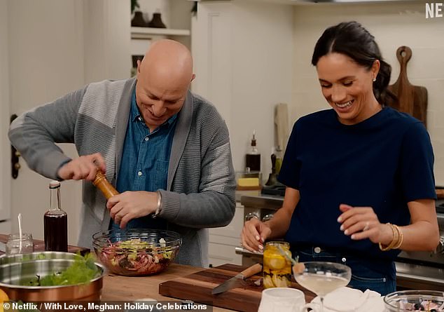 Chef Tom Colicchio and Meghan Markle cooking up a festive storm int he kitchen