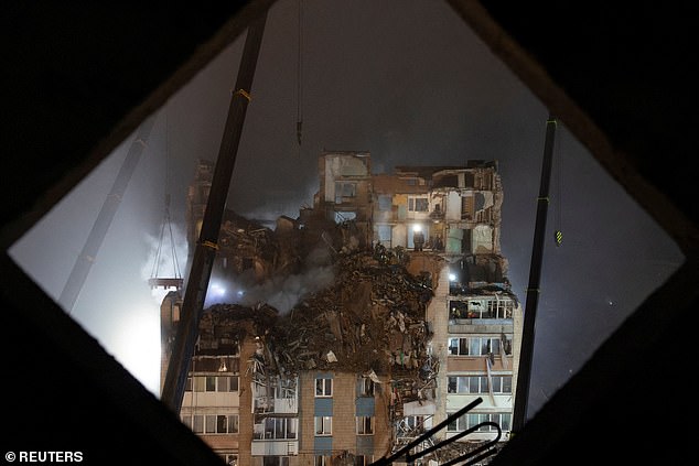 Rescuers clear debris at the site of an apartment building that was hit by a Russian missile, amid Russia's attack on Ukraine, in Ternopil, Ukraine November 20, 2025