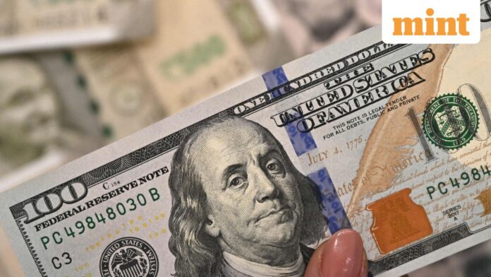 Alaska Permanent Fund: 600,000 eligible Americans to receive $1,000 payout A foreign exchange employee displays US dollar currency notes at an office.