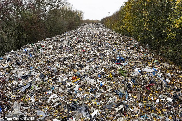 The pile of hazardous rubbish was illegally dumped in a field next to the A34 and River Cherwell near Kidlington in Oxfordshire