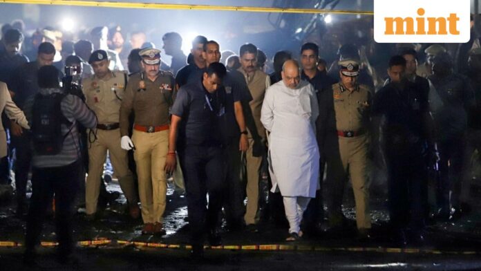 Delhi Blast: Police register case under UAPA, Explosives Act New Delhi, Nov 10 (ANI): Union Home Minister Amit Shah arrives at the spot of the blast in a Hyundai i20 car near Gate No. 1 of the Red Fort Metro station, in Delhi on Monday. (ANI Photo)