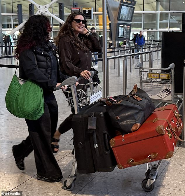 Despite upcoming Bushtucker Trials the model, 45, appeared in great spirits and flashed a huge smile as she became the first star to set off down under