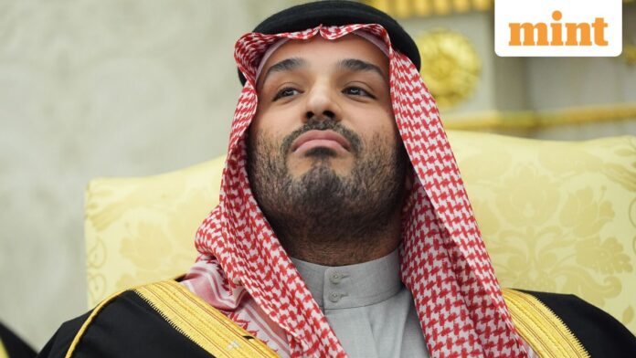 Saudi Arabia's Crown Prince Mohammed bin Salman listens as a reporter asks a question during a meeting with President Donald Trump in the Oval Office of the White House, Tuesday, Nov. 18, 2025, in Washington. (AP Photo/Evan Vucci)