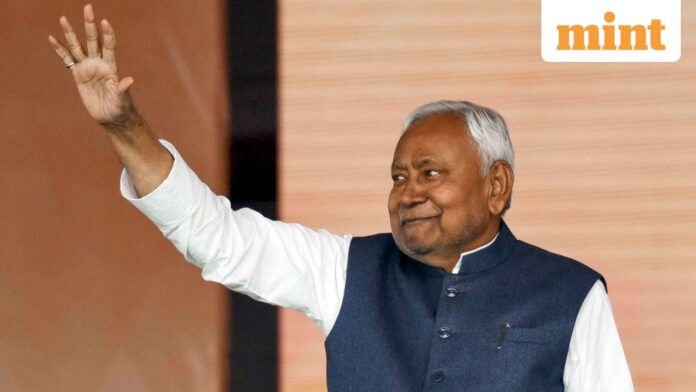 JD(U) supremo Nitish Kumar waves to the gathering during his swearing-in ceremony as the Chief Minister of Bihar, at Gandhi Maidan in Patna