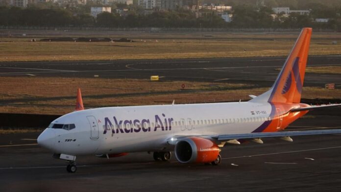 Scare on Varanasi-Mumbai Akasa Air flight as passenger tries to In this file photo, an Akasa Air passenger aircraft is seen on the tarmac at Chhatrapati Shivaji International Airport in Mumbai. For representational purposes.