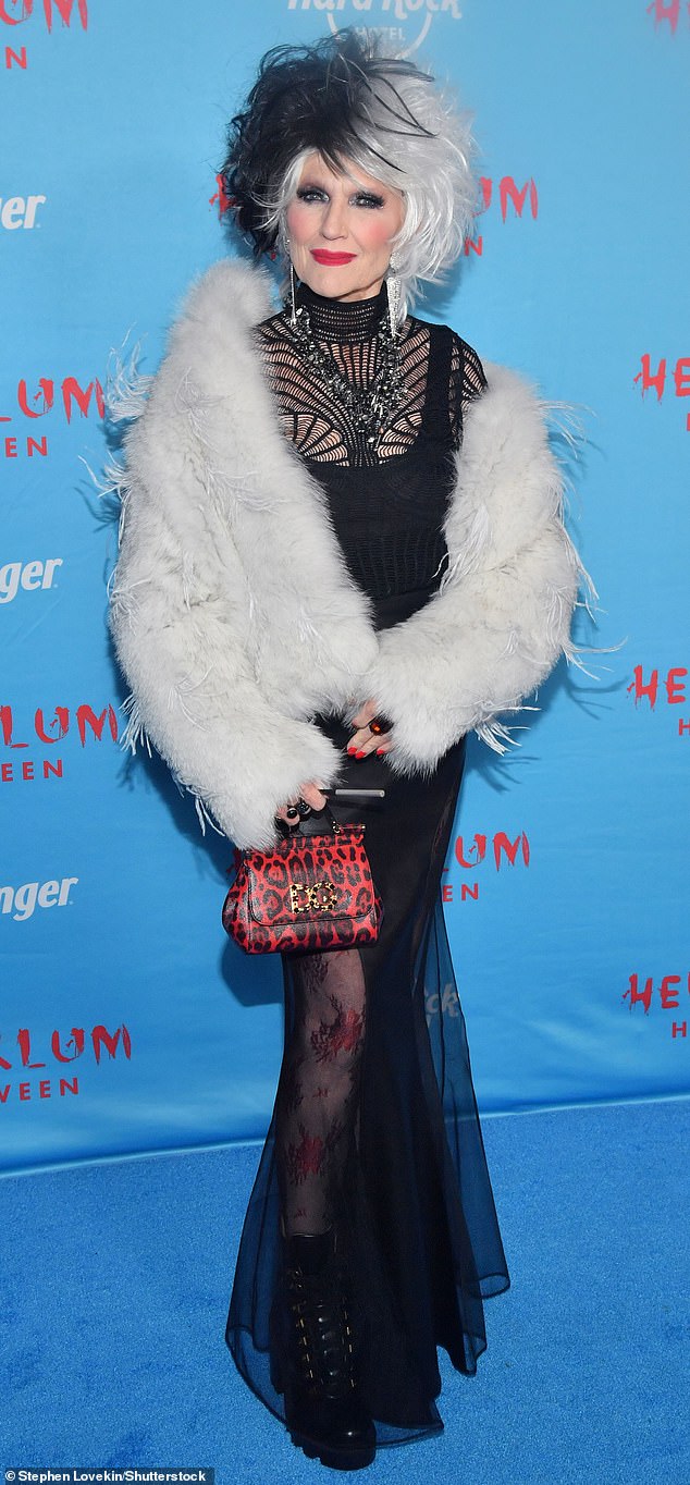 Elon Musk's mom, Maye, appeared at Heidi Klum's Halloween party dressed as Cruella de Vil, sporting the character's signature white-and-black hair and dramatic fur coat