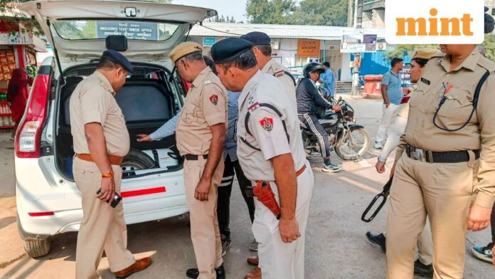Submit list of residents from J&K, foreign nationals: Gurugram police Gurugram: Security personnel check a vehicle at a railway station, after security was beefed up following a blast near the Red Fort, in Gurugram on Tuesday.