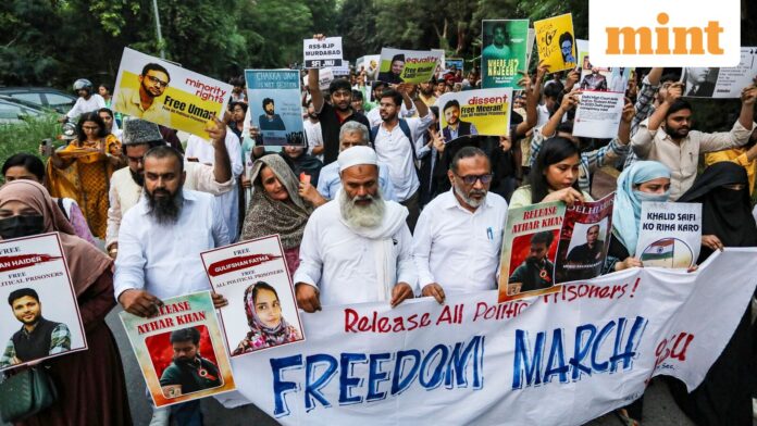 Umar Khalid, Sharjeel Imam bail case: 2020 Delhi riots 'orchestrated’, New Delhi: Family members of activists Umar Khalid, Sharjeel Imam, Gulfisha Fatima and Meeran Haider take part in a freedom march protest after the Supreme Court on Friday adjourned to September 19 bail pleas of the jailed activists in the UAPA case related to the alleged conspiracy behind the February 2020 riots in the national capital, in New Delhi, Saturday, Sept. 13, 2025. (PTI Photo) (PTI09_13_2025_000456B)